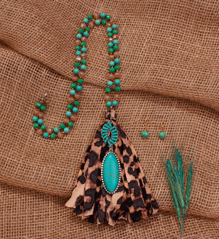 LONG TURQ NECKLACE WITH TURQUOISE CHARM AND LEO TASSEL